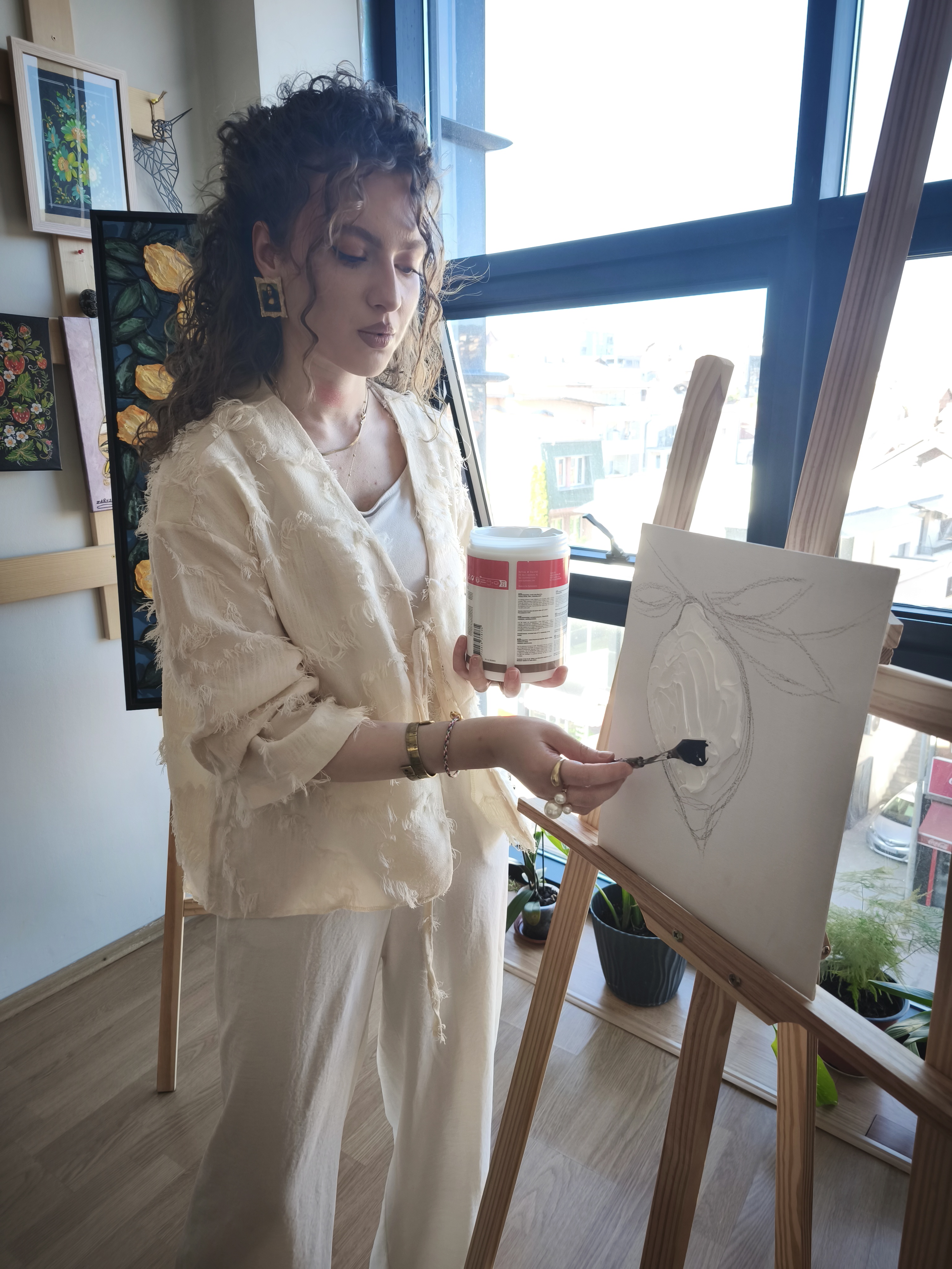 Elsa Hoti painting at the atelier